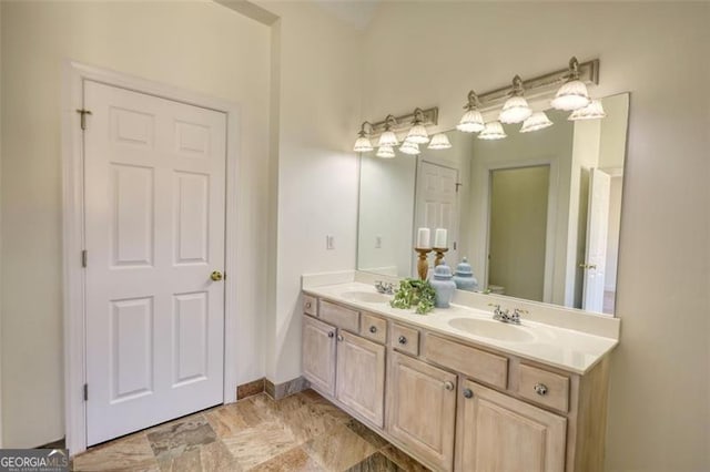 915 Cruce Lake Dr, Hoschton, GA 30548 - full bathroom with double vanity, baseboards, and a sink