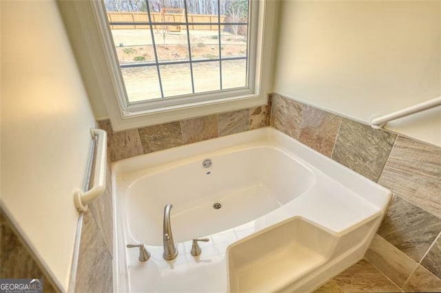 915 Cruce Lake Dr, Hoschton, GA 30548 - bathroom with a garden tub
