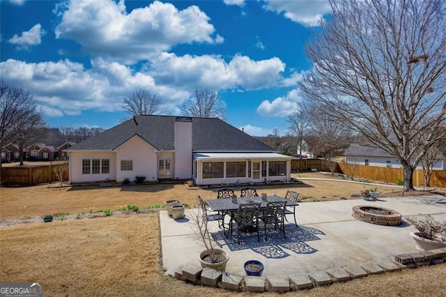 915 Cruce Lake Dr, Hoschton, GA 30548 - back of house with a patio area, a lawn, a fire pit, and a fenced backyard