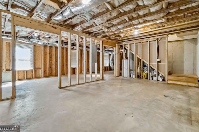 basement featuring freestanding refrigerator