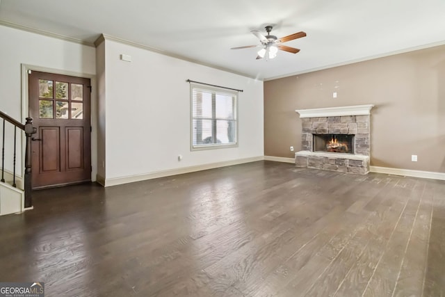 unfurnished living room featuring a wealth of natural light, crown molding, ceiling fan, and wood finished floors