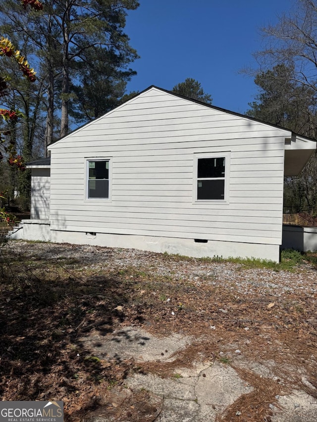 view of home's exterior with crawl space