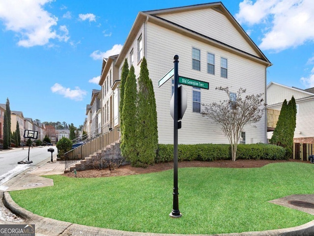 view of home's exterior featuring a yard