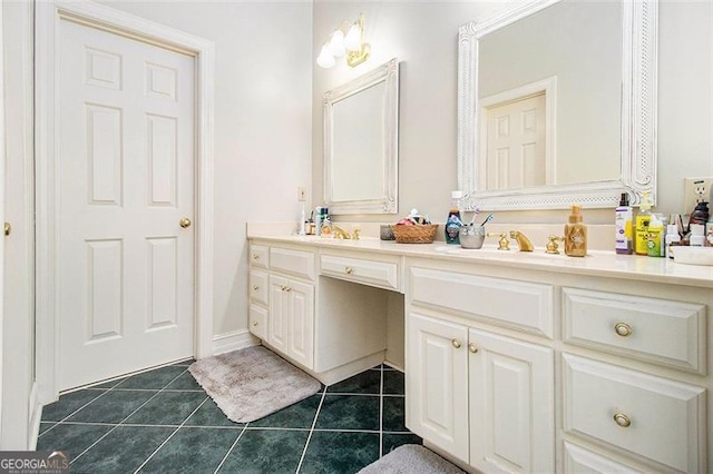 bathroom with tile patterned floors and vanity