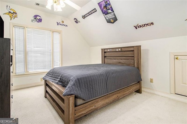 bedroom with baseboards, carpet, and vaulted ceiling