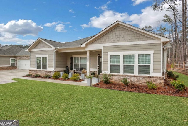 craftsman house featuring a front lawn, brick siding, and driveway