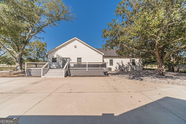 view of front of property with a wooden deck