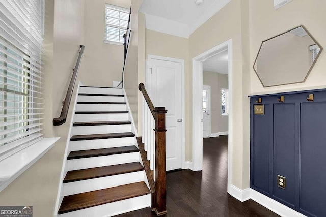 stairway with baseboards and wood finished floors
