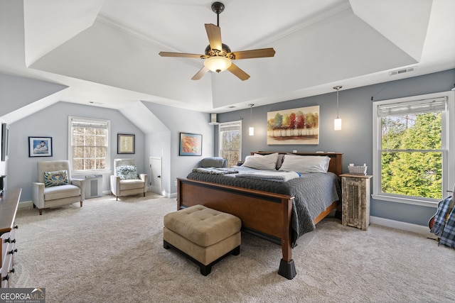 carpeted bedroom with visible vents, lofted ceiling, a ceiling fan, a tray ceiling, and baseboards