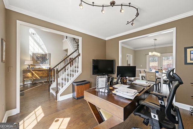 office featuring a chandelier, baseboards, wood finished floors, and ornamental molding