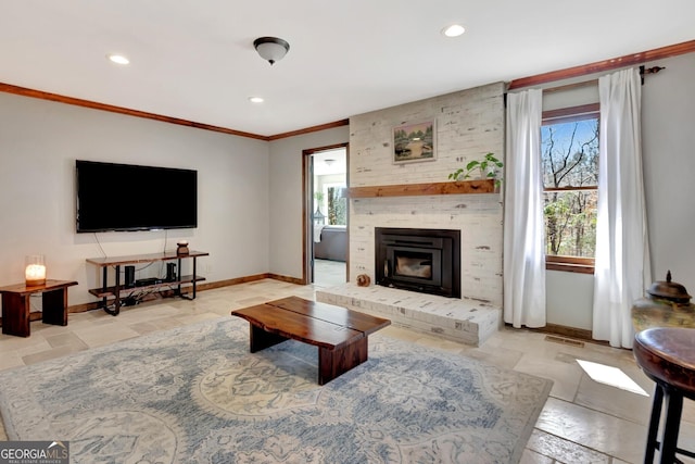 living room featuring a healthy amount of sunlight and baseboards