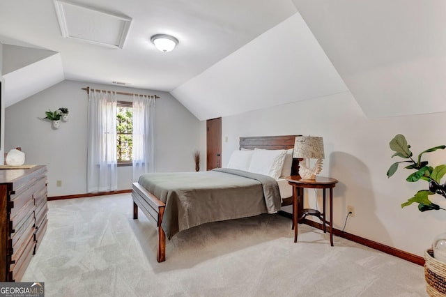 bedroom featuring visible vents, baseboards, light colored carpet, and lofted ceiling