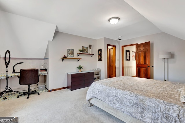 bedroom featuring baseboards, carpet floors, and lofted ceiling