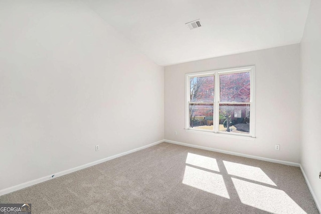 10950 Glenhurst Pass, Duluth, GA 30097 - empty room featuring carpet floors, baseboards, and vaulted ceiling