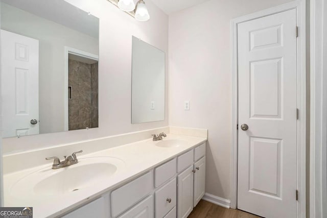 10950 Glenhurst Pass, Duluth, GA 30097 - bathroom with double vanity and wood finished floors