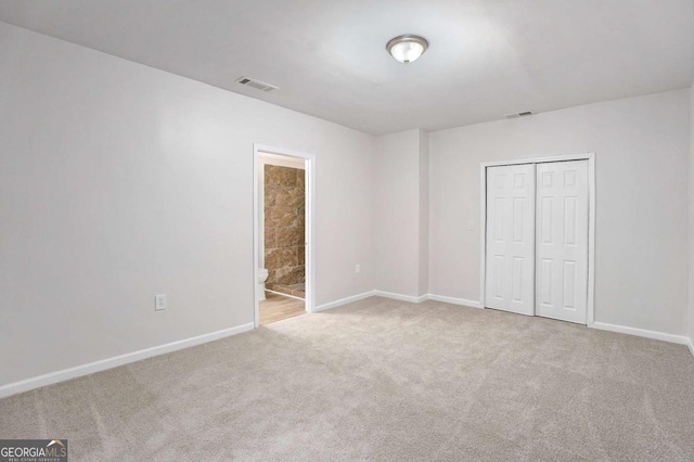 10950 Glenhurst Pass, Duluth, GA 30097 - unfurnished bedroom with carpet, baseboards, a closet, and ensuite bathroom