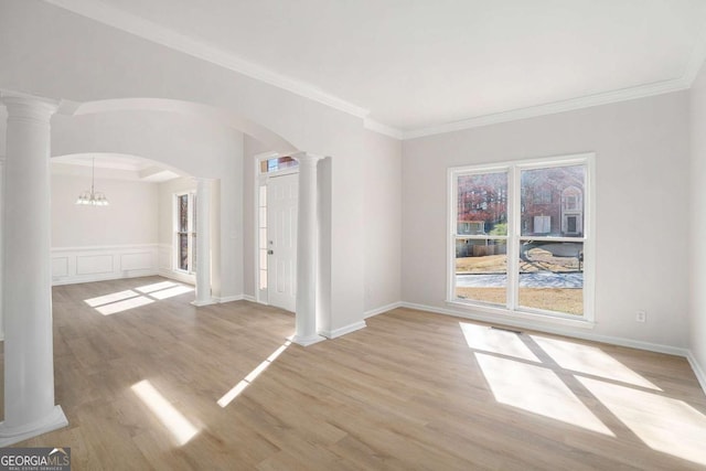 10950 Glenhurst Pass, Duluth, GA 30097 - spare room with ornate columns, arched walkways, light wood finished floors, ornamental molding, and baseboards