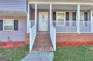 doorway to property featuring covered porch