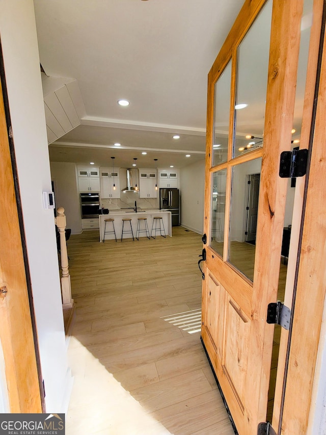 interior space featuring recessed lighting and light wood-style floors