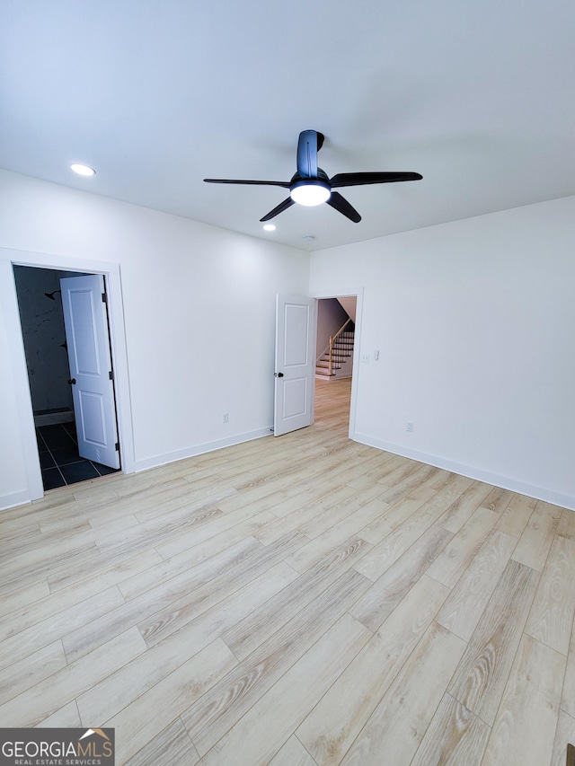 unfurnished room with light wood-style flooring, recessed lighting, baseboards, and ceiling fan