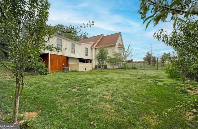 view of yard featuring central AC unit