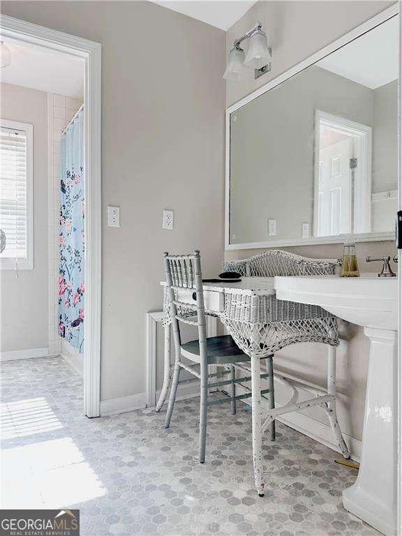 dining space featuring baseboards