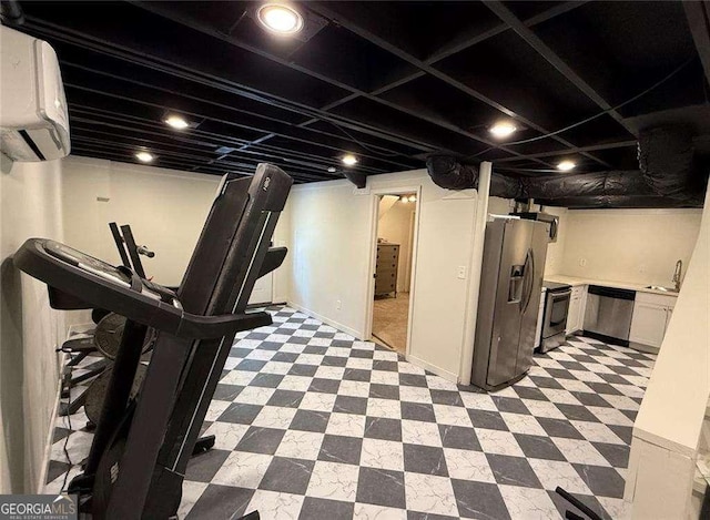 finished basement featuring a sink, light floors, a wall mounted air conditioner, and stainless steel fridge with ice dispenser