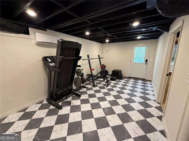 exercise area featuring tile patterned floors and baseboards