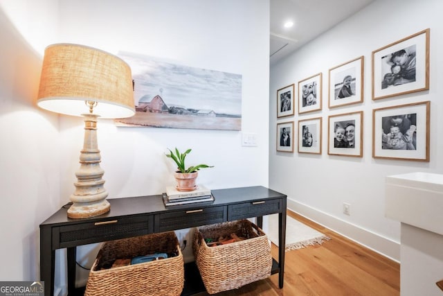 office space featuring attic access, recessed lighting, wood finished floors, and baseboards