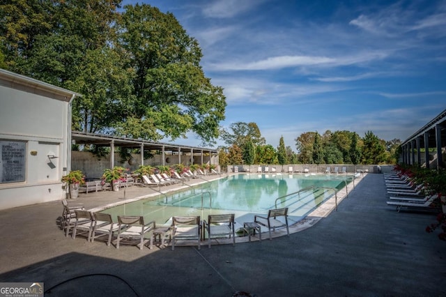 community pool with a patio