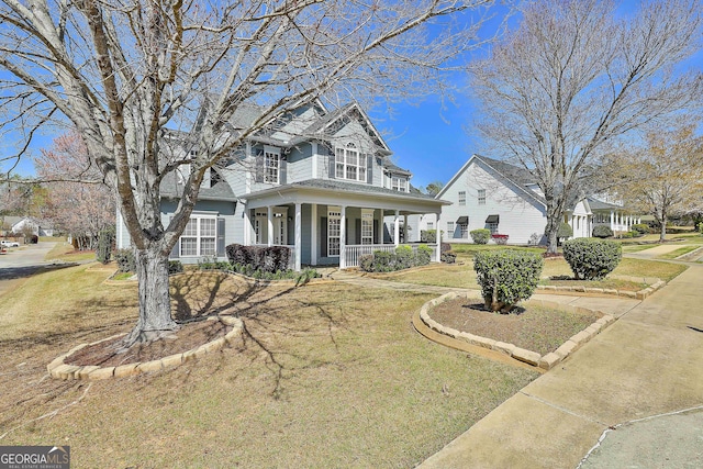 41 Eastlake Lndg, Newnan, GA 30265 - view of front of house featuring covered porch and a front yard
