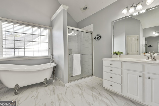 41 Eastlake Lndg, Newnan, GA 30265 - bathroom featuring vaulted ceiling, a freestanding tub, a stall shower, marble finish flooring, and vanity