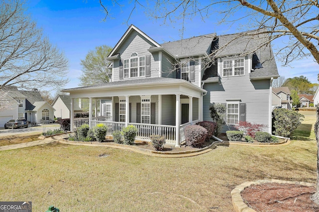 41 Eastlake Lndg, Newnan, GA 30265 - view of front of home with a porch, a front lawn, and roof with shingles