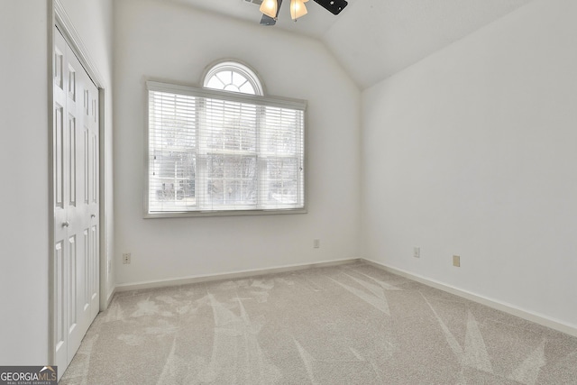 41 Eastlake Lndg, Newnan, GA 30265 - unfurnished bedroom featuring carpet floors, vaulted ceiling, a closet, and a ceiling fan