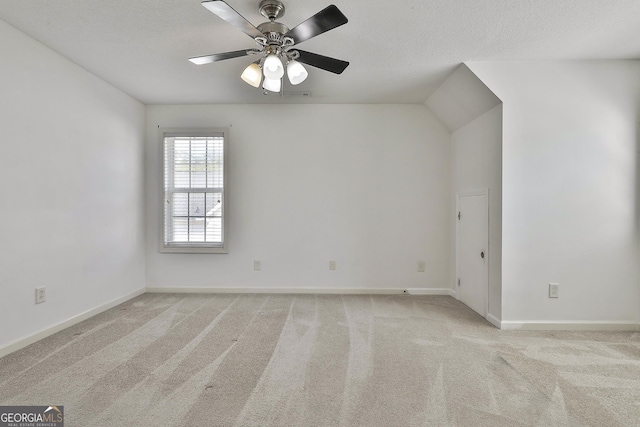 41 Eastlake Lndg, Newnan, GA 30265 - spare room with light colored carpet, a ceiling fan, and a textured ceiling