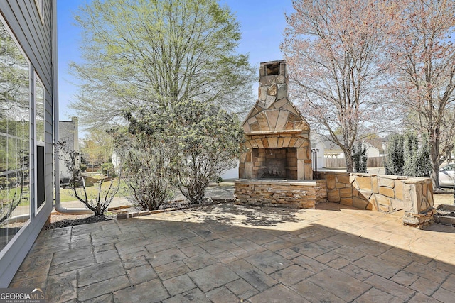 41 Eastlake Lndg, Newnan, GA 30265 - view of patio / terrace featuring an outdoor stone fireplace