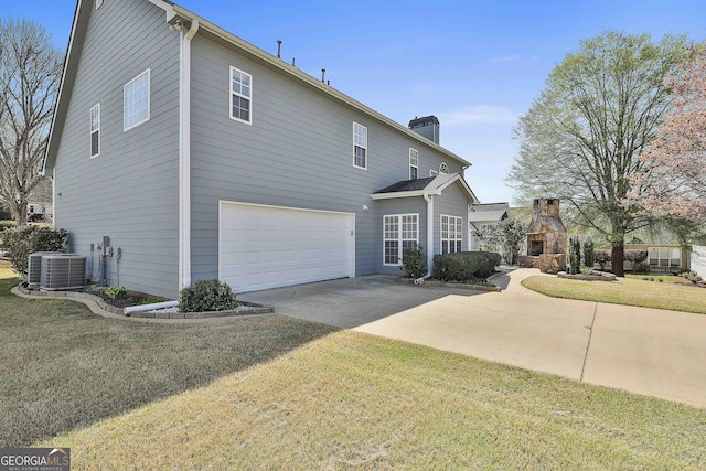 41 Eastlake Lndg, Newnan, GA 30265 - view of home's exterior featuring an attached garage, concrete driveway, a chimney, and a yard