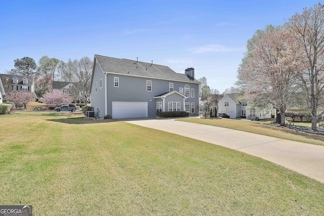 41 Eastlake Lndg, Newnan, GA 30265 - view of front facade featuring a garage, concrete driveway, a front yard, and a chimney