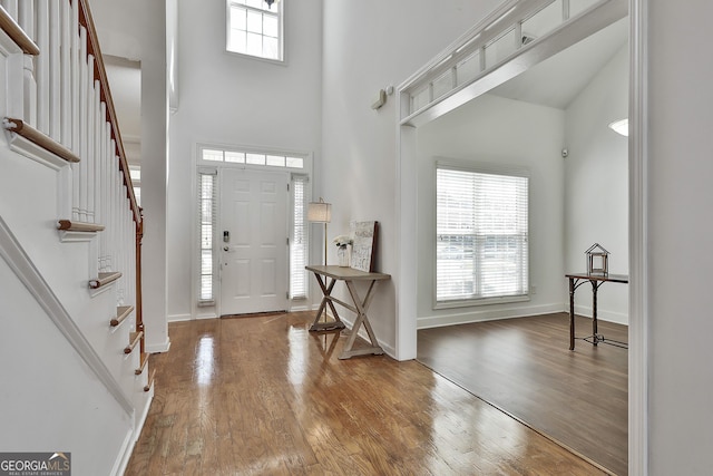 41 Eastlake Lndg, Newnan, GA 30265 - entryway with a high ceiling, stairway, and wood finished floors