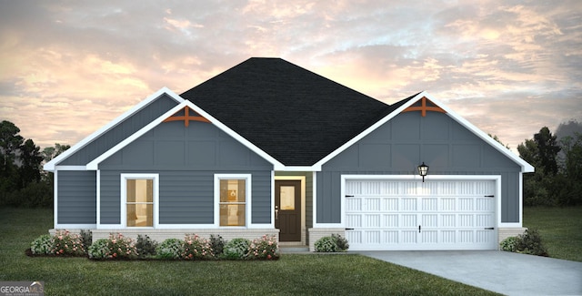 view of front of house featuring a yard, brick siding, a garage, and a shingled roof