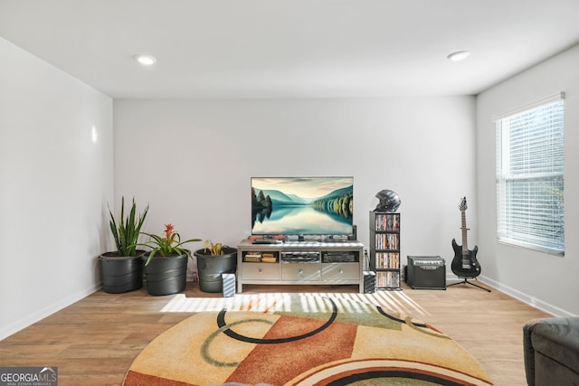 interior space with recessed lighting, baseboards, and wood finished floors