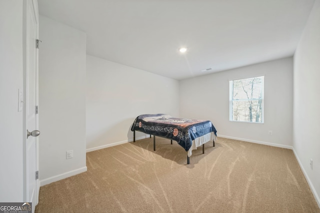 carpeted bedroom featuring recessed lighting, visible vents, and baseboards