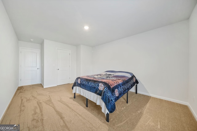 bedroom with recessed lighting, baseboards, and carpet flooring