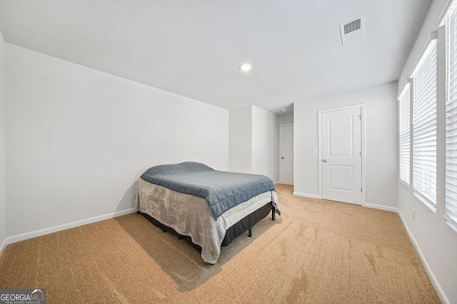 carpeted bedroom with visible vents, recessed lighting, and baseboards