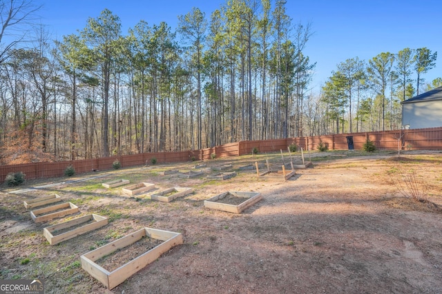 view of yard featuring a garden and fence