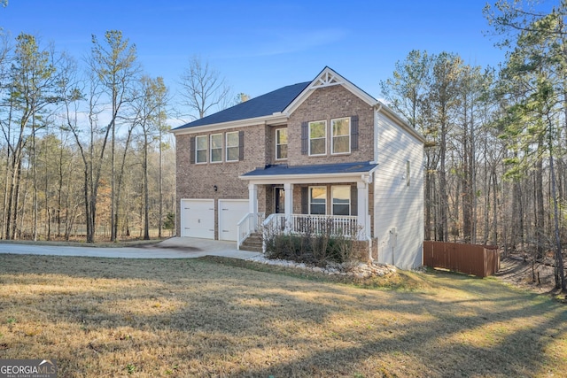 view of front facade featuring a front yard, driveway, a porch, a garage, and brick siding