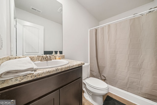 bathroom with a shower with shower curtain, visible vents, toilet, and vanity