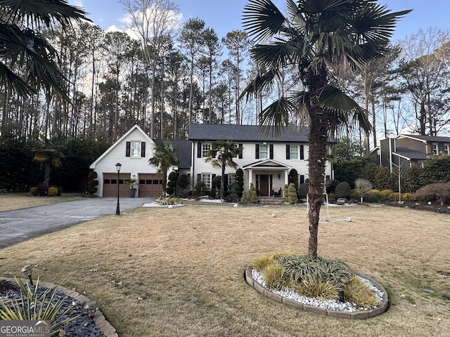 view of front of home with aphalt driveway