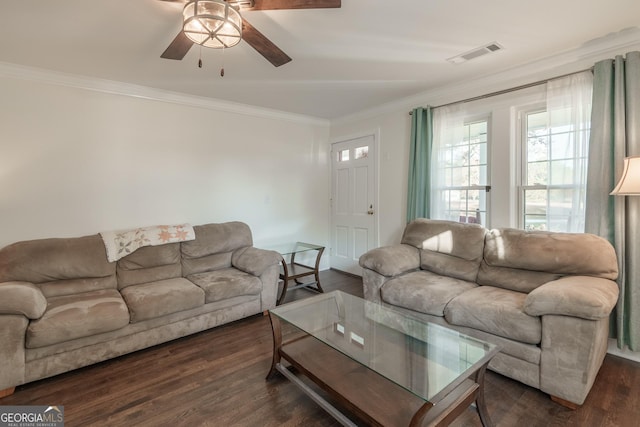 living room with visible vents, crown molding, ceiling fan, and dark wood-style flooring