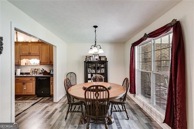144 Bobs Dr, Mableton, GA 30126 - dining room featuring a notable chandelier and wood finished floors